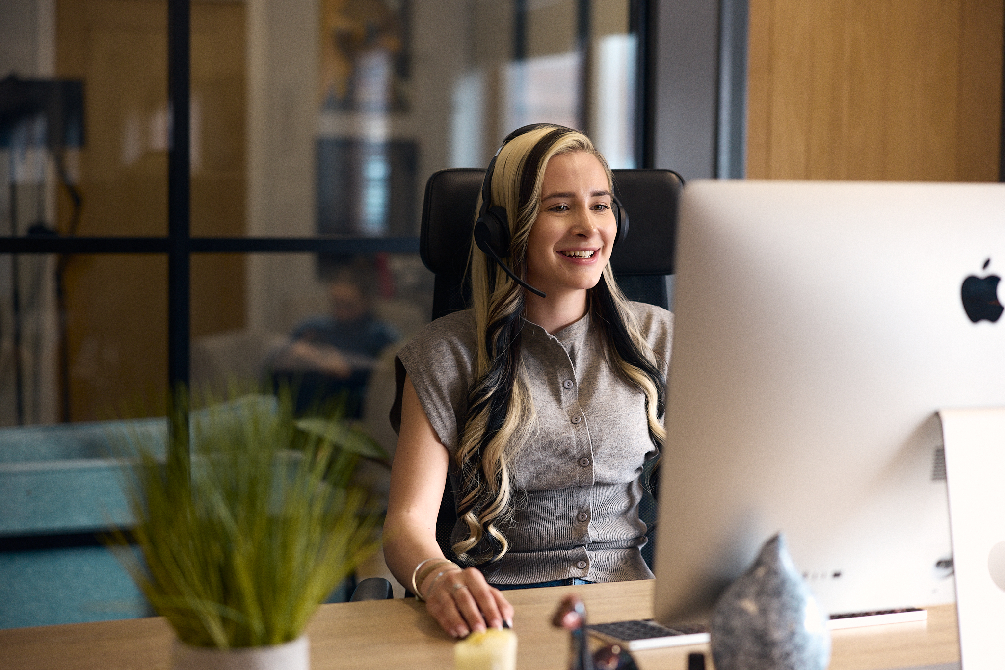 Executive Life adviser talking to a client on a headset